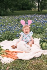 Photo of girl with bunny in flowers