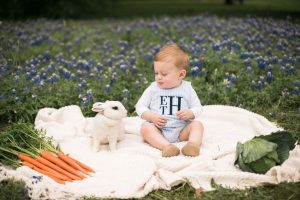Photo of boy with bunny in flowers